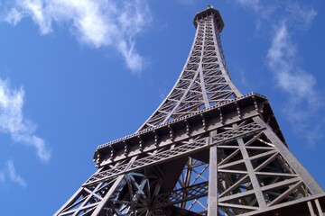 Eiffel tower on the blue sky background.