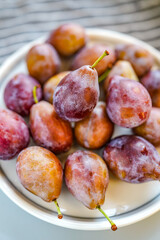 Indoor studio fresh prunes close-up