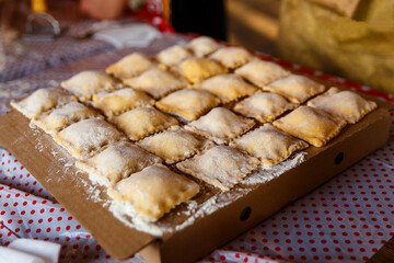 ravioli on wooden board