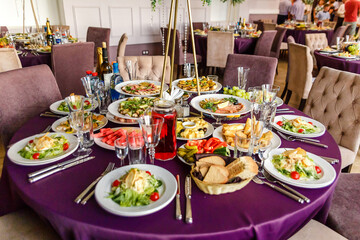 dishes at the round table in the restaurant