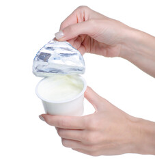 Plastic container with yogurt in hand on white background isolation