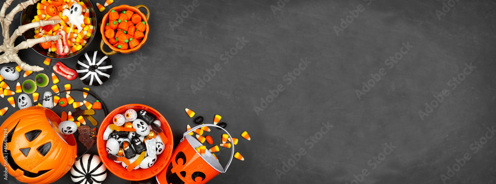 Poster halloween trick or treat corner border with jack o lantern pails and a variety of candy. above view 