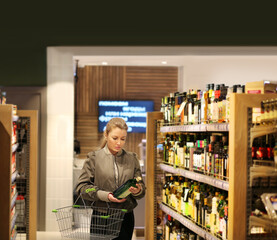 supermarket shopping,Woman choosing a dairy products at supermarket.