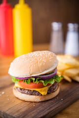 fresh cheese hamburger on wooden cutting board