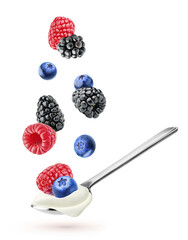 Yogurt with fruits. Flying berries (blueberry, raspberry, blackberry) over of spoon of greek yogurt isolated on white background