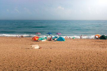 Fototapeta na wymiar seascape for boumerdas beach in algeria with people and tourists in the sand, algeria nature