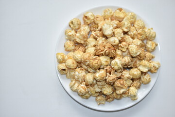 Popcorn covered with icing and caramel with sugar
