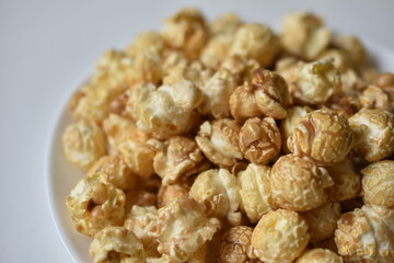 Popcorn covered with icing and caramel with sugar