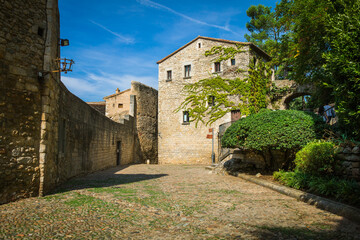 Fototapeta na wymiar Streets of Girona - Spain, with the Girona Catedral, Basilica de Saint Feliu, Capella de Sant Nicolau and the city walls of Girona