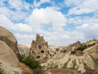 Fototapeta na wymiar The valleys of Cappadocia with caves in the rocks