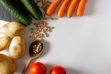 Natural ingredients. Carrot, potato, pumpkin, tomato, chickpeas. Mediterranean food. Flat lay. Copy space.