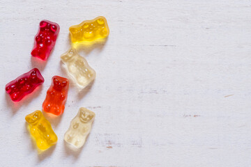 Colorful jelly beans, teddy bears on a white background