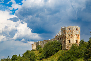 Fototapeta na wymiar Ancient ruined Pniv castle outdoor, on hill, western Ukraine. Ukrainian architectural landmark.