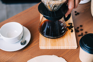 Alternative coffee brewing method, using pour over dripper and paper filter.