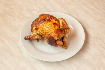 Grilled chicken on spit with very crispy skin