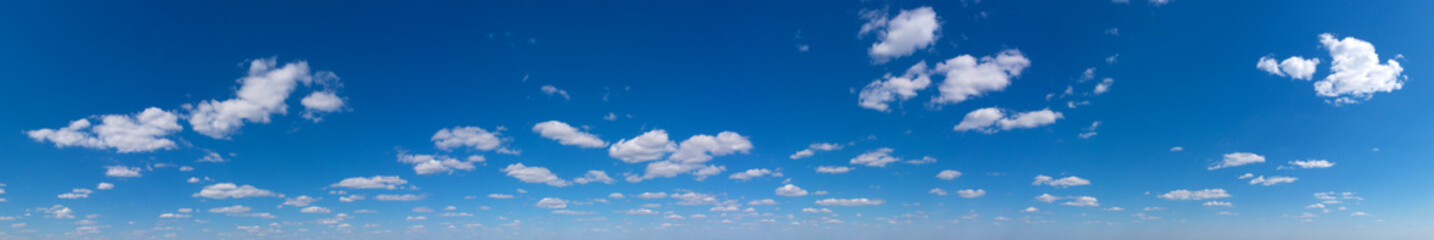 Obraz premium Blue Sky background with tiny Clouds. Panorama background