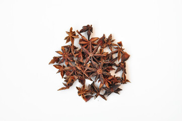 Aromatic anise stars and cinnamon on white background