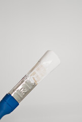 brush in white paint, home repair tools