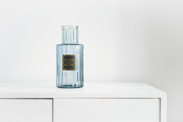 blue glass vase with the words "home sweet home"