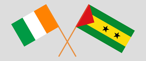 Crossed flags of Republic of Ivory Coast and Sao Tome and Principe. Official colors. Correct proportion