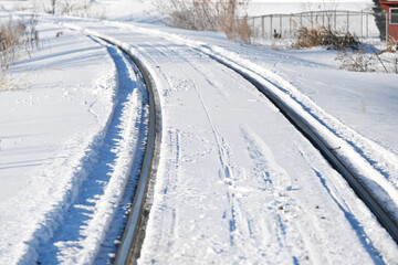 Fototapeta na wymiar Railroad Tracks in Snow