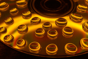 Creative shot of water droplets on a CD. 