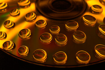 Creative shot of water droplets on a CD. 
