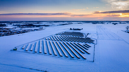 Alternative energy at winter. Snow covered solar panels in winter.