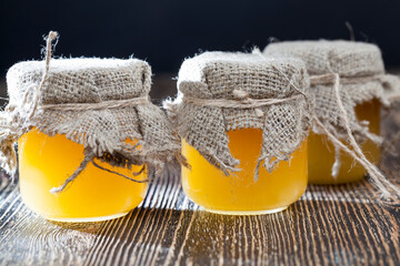 fresh bee honey packed in glass jars