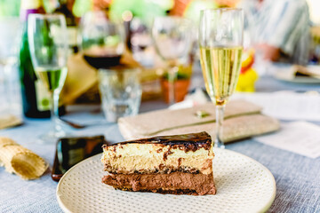 A piece of delicious cake cut on a plate in a fancy restaurant.
