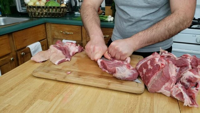 Home Cooking - Time Lapse Of Skin Being Removed Or Cut Away From Pork Shoulder Preparing Meat For Next Step Before Cooking.