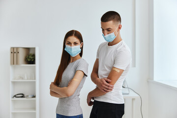 men and women wearing medical masks next to each other in hospital covid passport