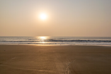 The morning sun made the sea and the beach golden