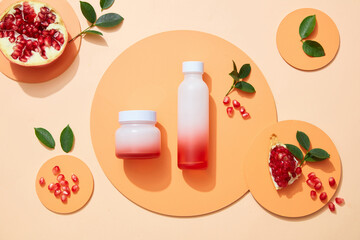 Blank lable Cosmetic set for skin care with pomegranate extract. Whole pomegranate and pomegranate...