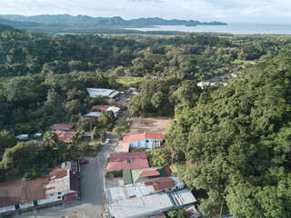The small town of Paquera Costa Rica located about a mile or less from the shores of the gulf of Nicoya on the Peninsula as seen from an aerial drone image