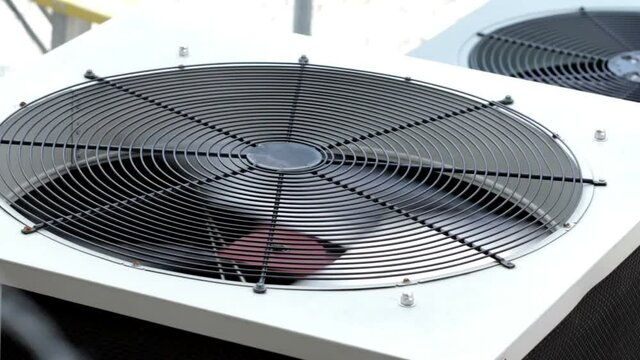 outside air conditioner fan blade spinning