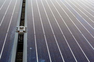 Side support bracked between solar panels on a new installation on a residential roof