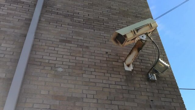 security camera on side of building