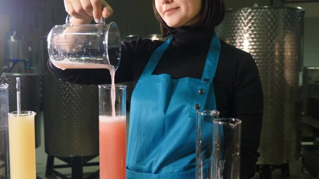 Wine making. winemakers laboratory testing wine in winery lab. Measurement alcohol content cold stability density malic acid red grape color sugar sulfur dioxide pH. 4 k video