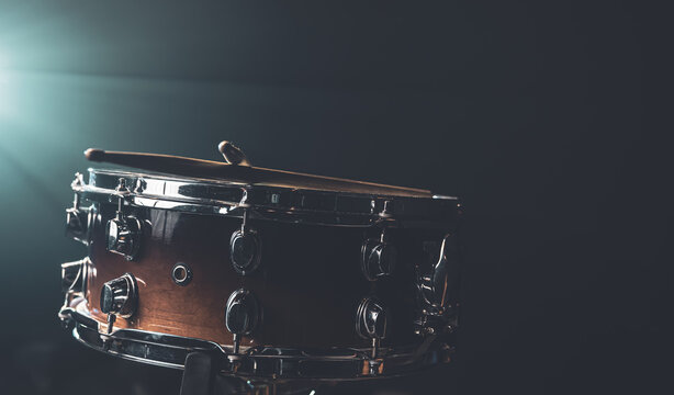 Snare drum on a black background, musical instrument, musical concept. - Powered by Adobe