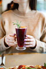 woman with mulled wine in the hands