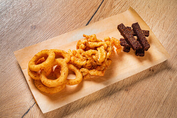 different snacks on the wooden tray