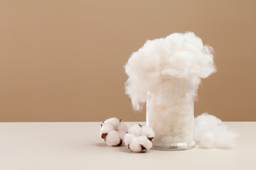 cotton flowers and cotton fiber on desk. natural material.