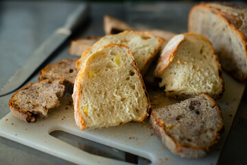 Sliced wheat bread on a plastic board