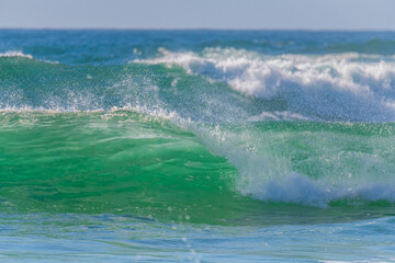 Clear blue skies and surfs up at the seaside