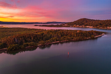 Aerial sunset waterscape over the bay with high cloud