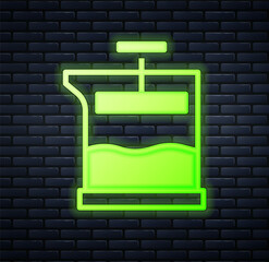 Glowing neon French press icon isolated on brick wall background. Vector