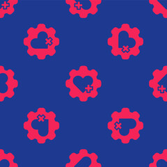 Red Heart with a cross icon isolated seamless pattern on blue background. First aid. Healthcare, medical and pharmacy sign. Vector
