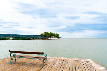 KESZTHELY, HUNGARY - JULY 3, 2020: Romantic bench overlooking the pier of Keszthely, Hungary