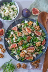 healthy autumn salad with figs and walnuts